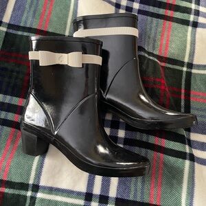Heeled Kate Spade rain boots with white bows